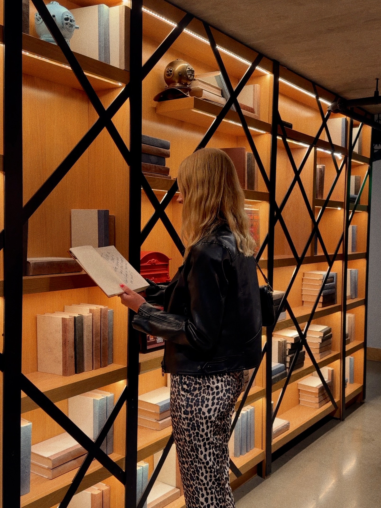 She reached for the red book, and the night unfolded from there. Some stories are meant to be discovered. 📕✨ Step inside and see where the next chapter takes you. 📸: @carlys_comida